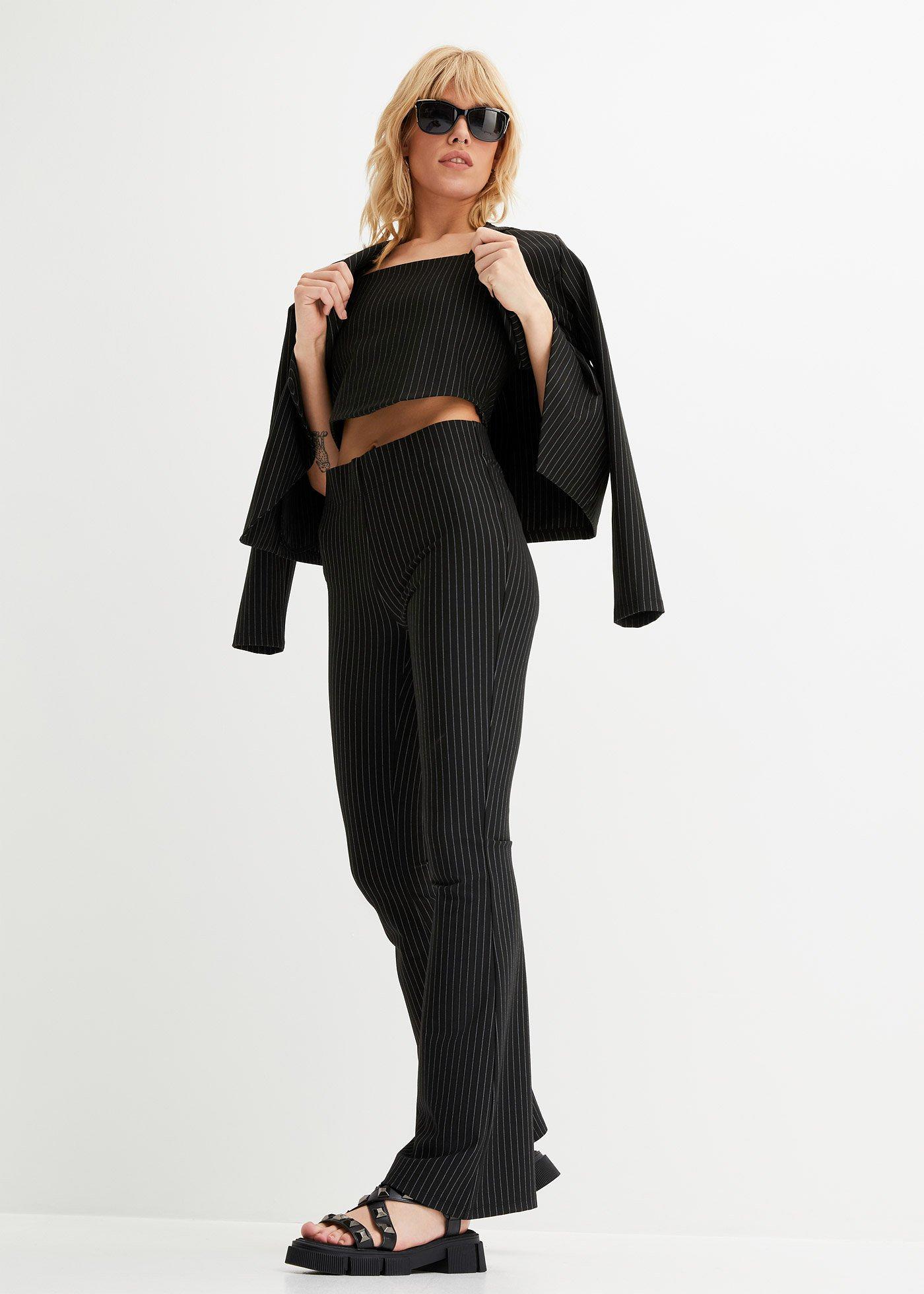 Spodnie poszerzane w tenisowe prążki - Bonprix