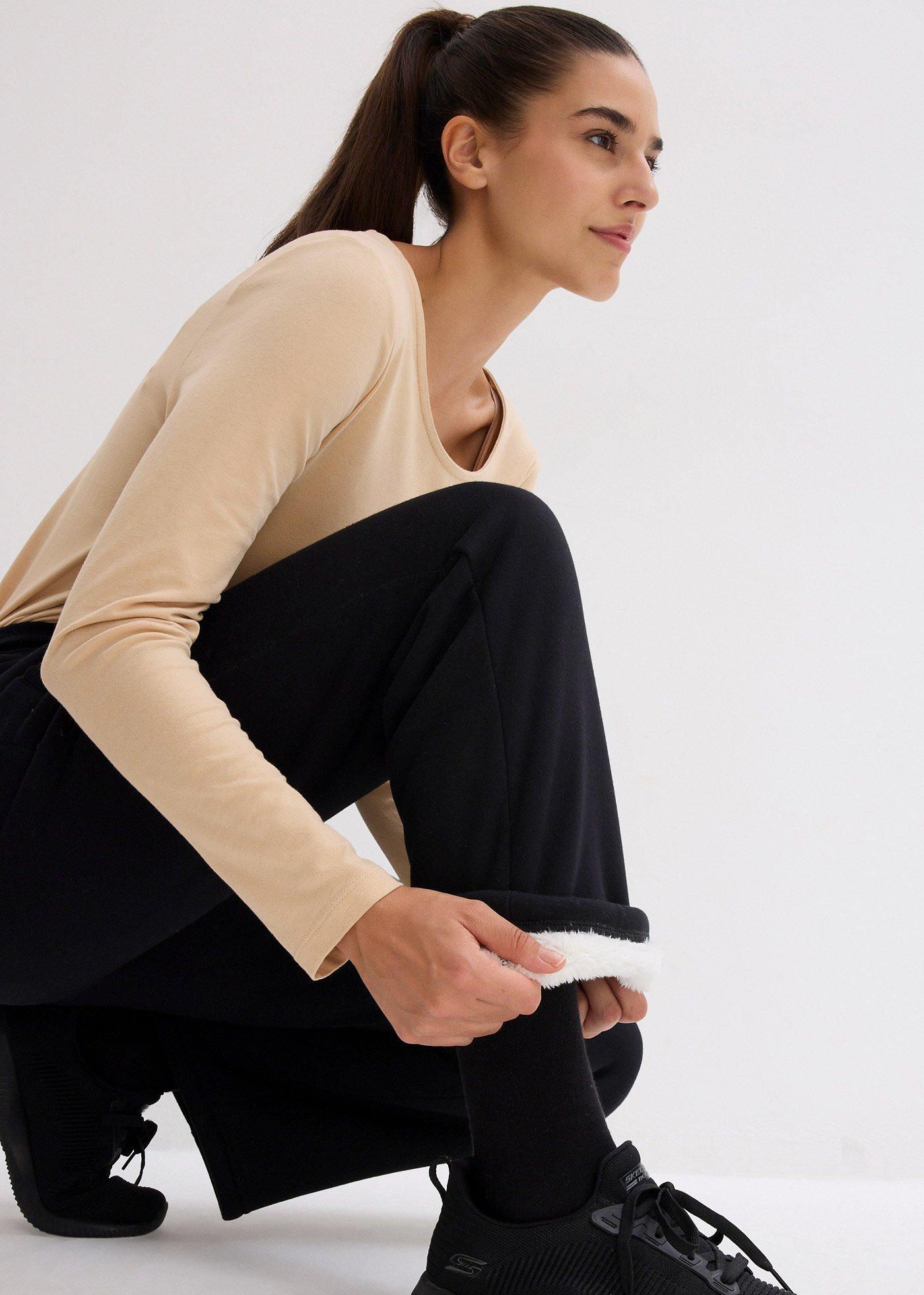 Spodnie sportowe ocieplane, na miękkiej podszewce z polaru, szeroki fason - Bonprix