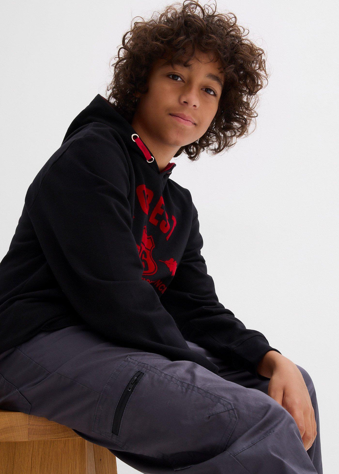 Ocieplane spodnie bojówki z dżersejową podszewką o kroju loose fit - Bonprix