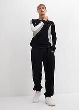Jogginghose aus schwerer Baumwollqualität, Loose Fit in schwarz im Look von vorne (Totalaufnahme) - bonprix
