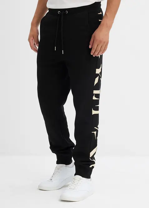 Jogginghose mit Seitenstreifen aus Bio-Baumwolle in schwarz von vorne - bonprix