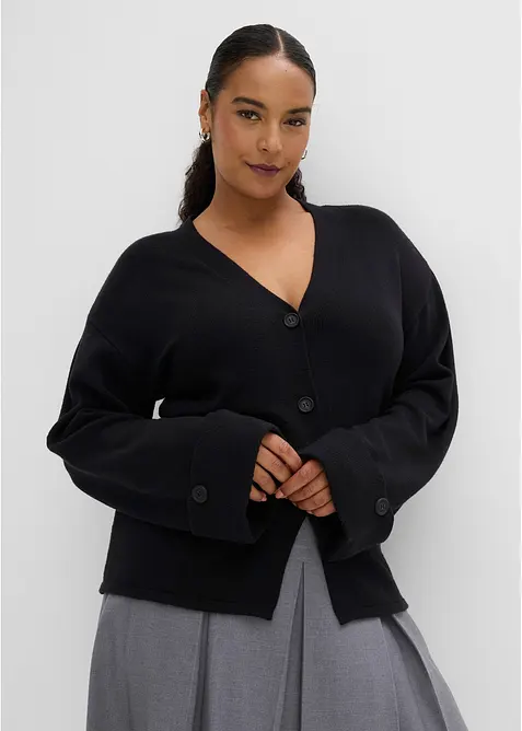 Taillierte Strickjacke aus Viskose-Mix in schwarz von vorne (im Anschnitt) - bonprix