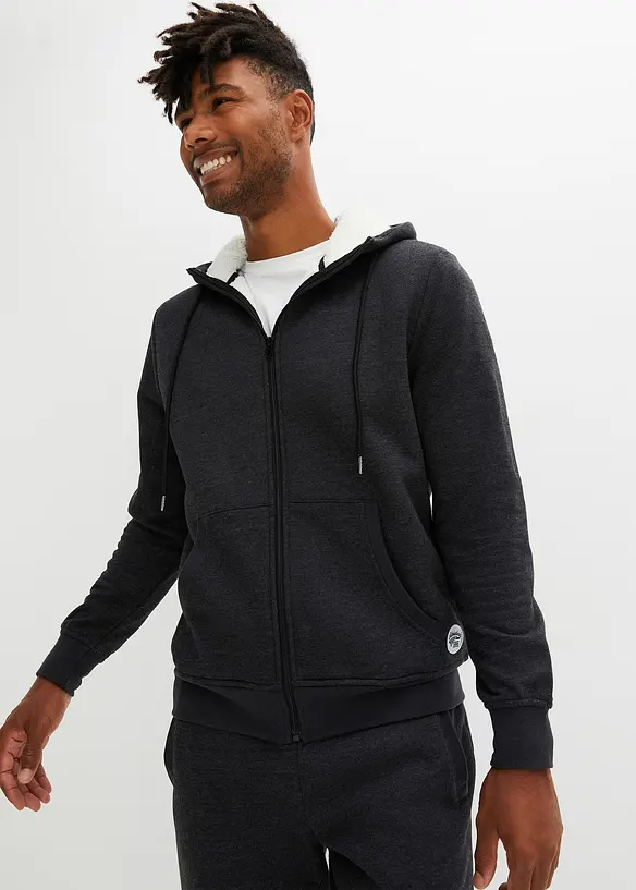 Thermo-Sweatjacke mit flauschigem Teddyfleece in schwarz von vorne (im Anschnitt) - bonprix