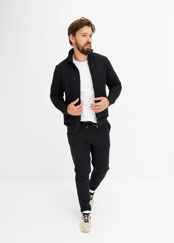 Thermo-Jogginganzug mit flauschigem Teddyfleece in schwarz von vorne (Totalaufnahme) - bonprix