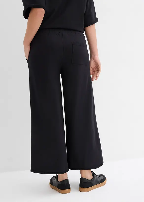 Weite Sweathose aus reiner Bio-Baumwolle, 7/8 Länge in schwarz von hinten - bonprix