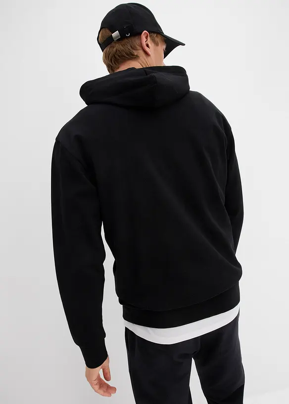 Hoodie in Loose Fit in schwarz von hinten (im Anschnitt) - bonprix