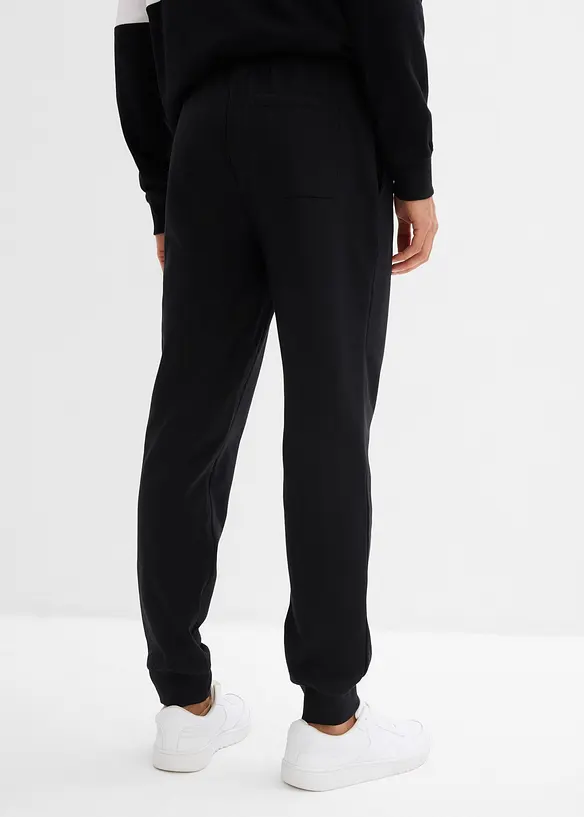 Jogginghose in Regular Fit in schwarz von hinten - bonprix