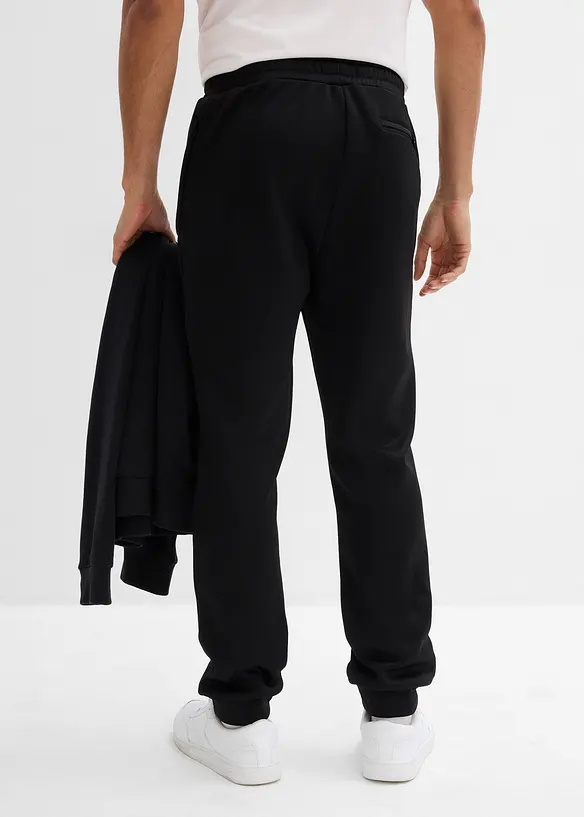 Thermo-Jogginghose mit Reißverschlusstaschen in schwarz von hinten - bonprix