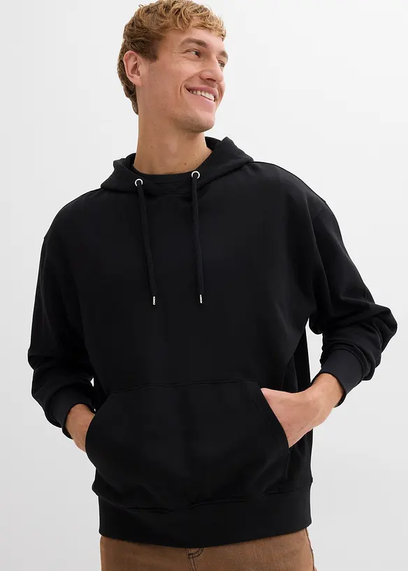 Hoodie in Loose Fit in schwarz von vorne (im Anschnitt) - bonprix
