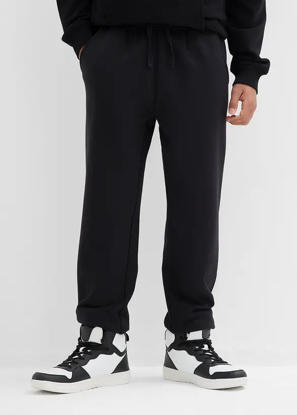 Jogginghose aus weichem Baumwoll-Mix (2er Pack) in schwarz von vorne - bonprix