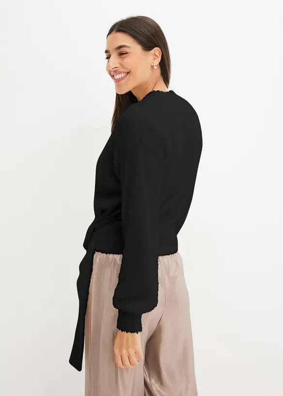 Wickelpullover mit Accessoire in schwarz von hinten (im Anschnitt) - bonprix