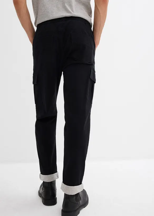 Relaxed Fit Thermo-Schlupfhose, Tapered in schwarz von hinten - bonprix