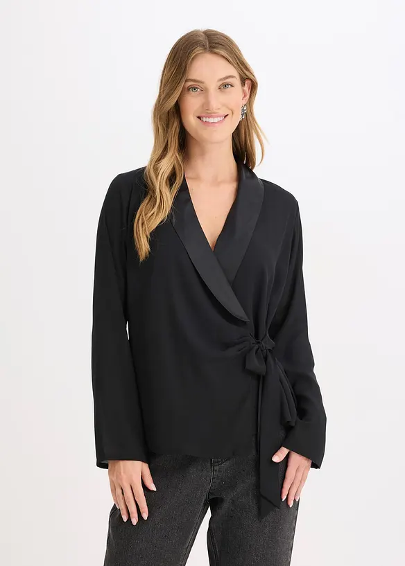 Wickelbluse mit seitlicher Schleife in schwarz von vorne (im Anschnitt) - bonprix Wickelbluse mit seitlicher Schleife in schwarz von vorne (im Anschnitt) - bonprix