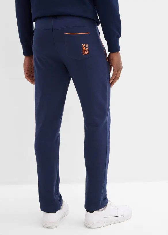 Jogginghose mit Reißverschlusstaschen in blau von hinten - bonprix