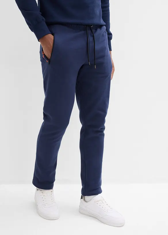 Jogginghose mit Reißverschlusstaschen in blau von vorne - bonprix