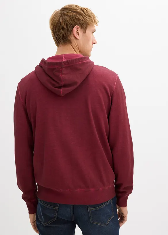Kapuzen-Sweatjacke in ausgewaschener Optik in rot von hinten (im Anschnitt) - bonprix