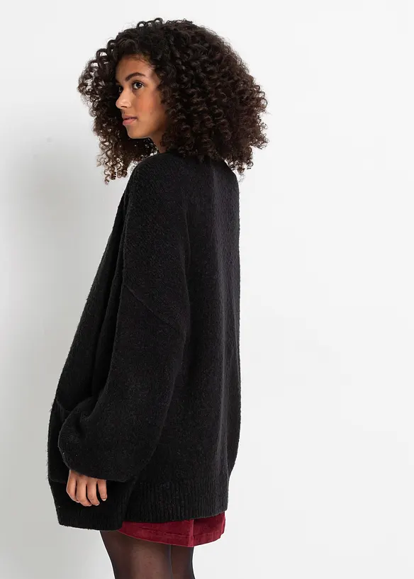 Oversize-Strickjacke in schwarz von hinten (im Anschnitt) - bonprix