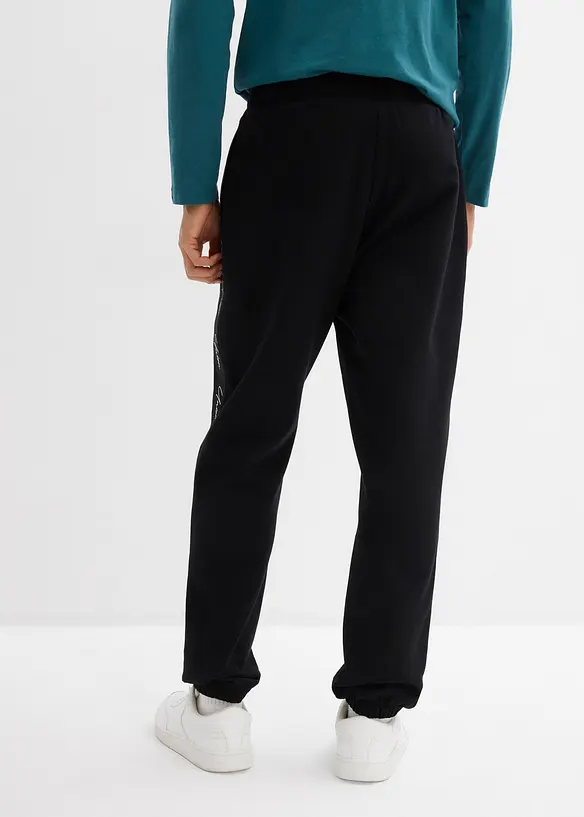 Jogginghose aus reiner Bio-Baumwolle, Loose Fit in schwarz von hinten - bonprix