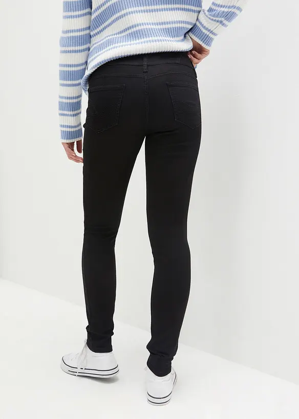 Wärmende Skinny Jeans High Waist, Shaping in schwarz von hinten - bonprix