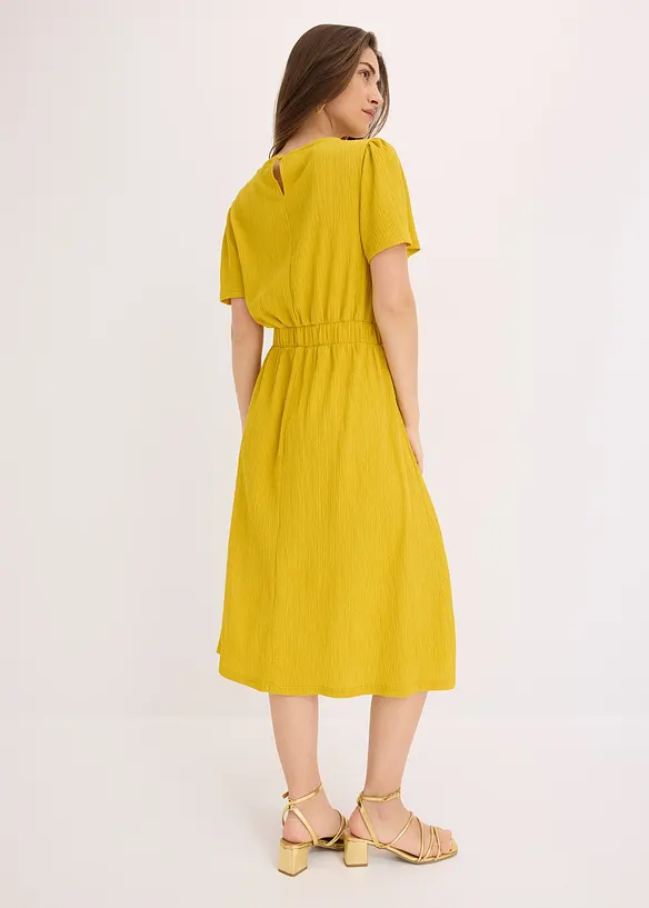 Ausgestelltes Jerseykleid in gelb von hinten (Totalaufnahme) - bonprix