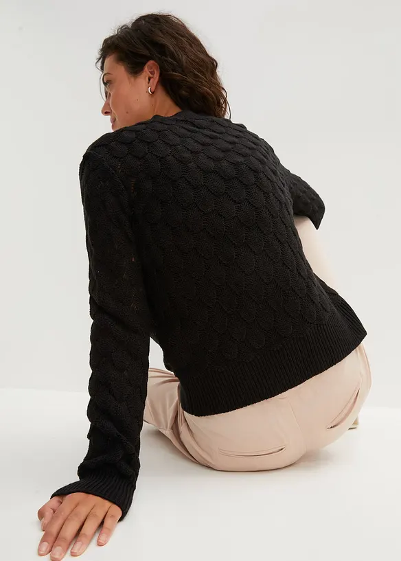 Ajour-Strickjacke in schwarz von hinten (im Anschnitt) - bonprix