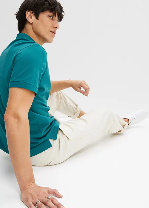 Piqué-Poloshirt aus reiner Bio-Baumwolle in petrol von hinten (im Anschnitt) - bonprix