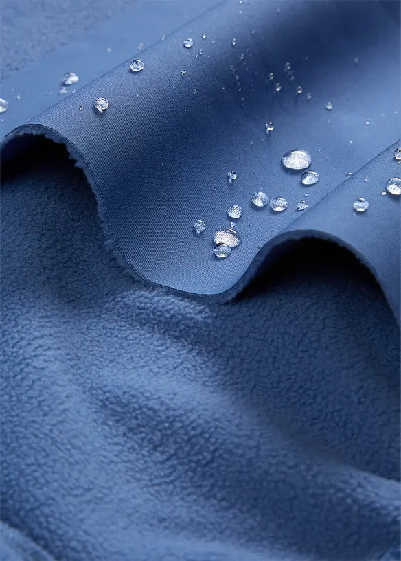 Softshelljacke mit Kapuze, wasserabweisend in blau - bonprix