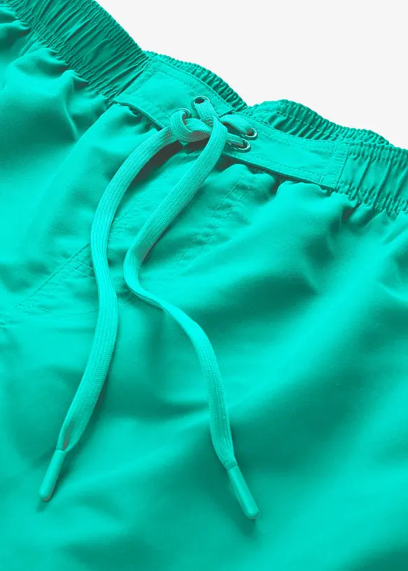 Badeshorts mit seitlichen Taschen in grün - bonprix
