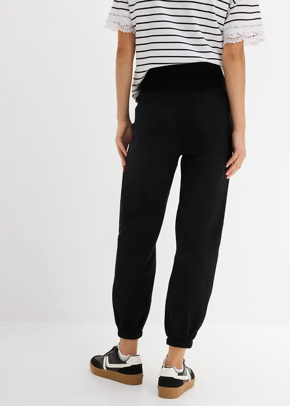 2-in-1 Umstandshose aus reinem Baumwollmusselin für die Schwangerschaft und danach in schwarz von hinten - bonprix