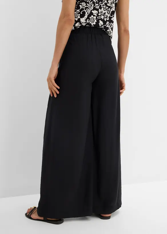 Schlupfhose aus strukturiertem Viskose-Mix in schwarz von hinten - bonprix