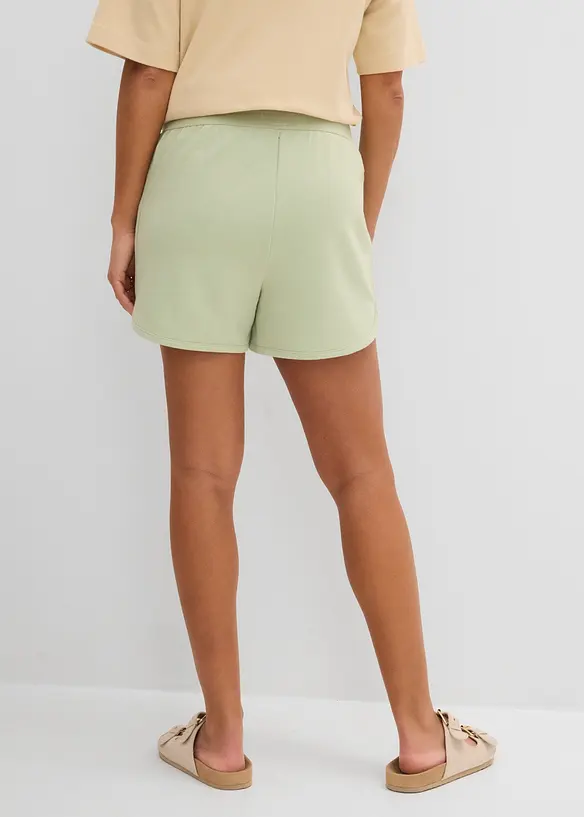Sweat-Shorts mit abgerundetem Saum in grün von hinten - bonprix