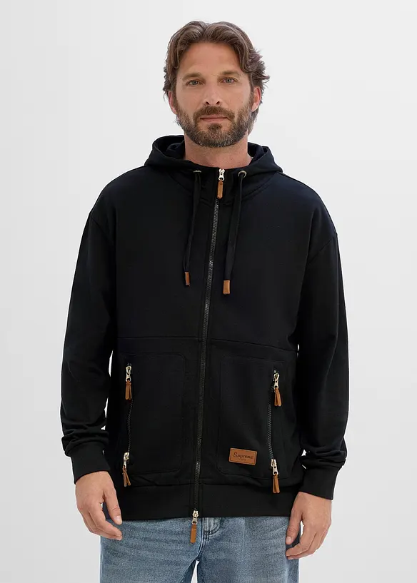 Kapuzen-Sweatjacke aus weichem Baumwoll-Mix, Loose Fit in schwarz von vorne (im Anschnitt) - bonprix