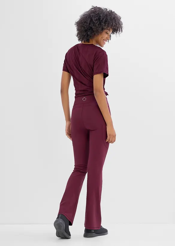 Ausgestellte Komfort Sport-Leggings mit Handytasche, schnelltrocknend in lila von hinten - bonprix
