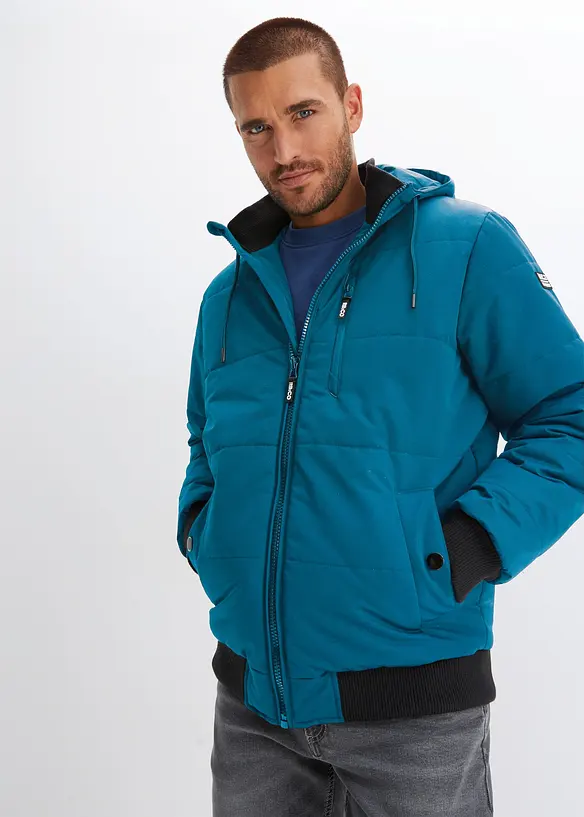 Winter-Steppjacke in Blousonform mit Kapuze in petrol von vorne (im Anschnitt) - bonprix