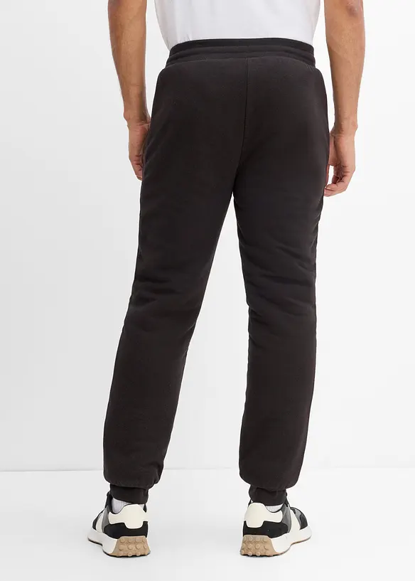 Thermo-Jogginghose mit flauschigem Teddyfleece in schwarz von hinten - bonprix