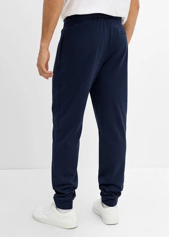 Thermo-Jogginghose mit Reißverschlusstaschen in blau von hinten - bonprix