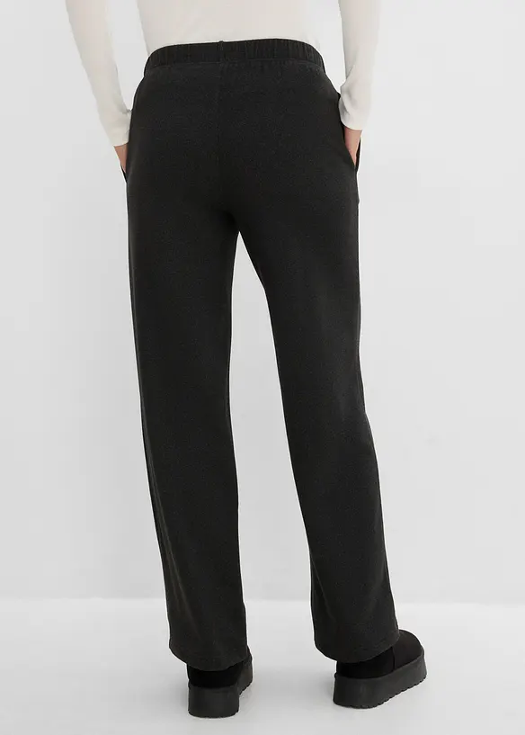 Schlupfhose aus weichem Rippjersey in schwarz von hinten - bonprix