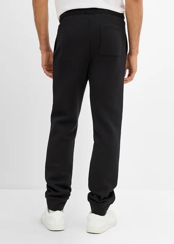 Jogginghose aus schwerer Qualität mit PU-Details in schwarz von hinten - bonprix