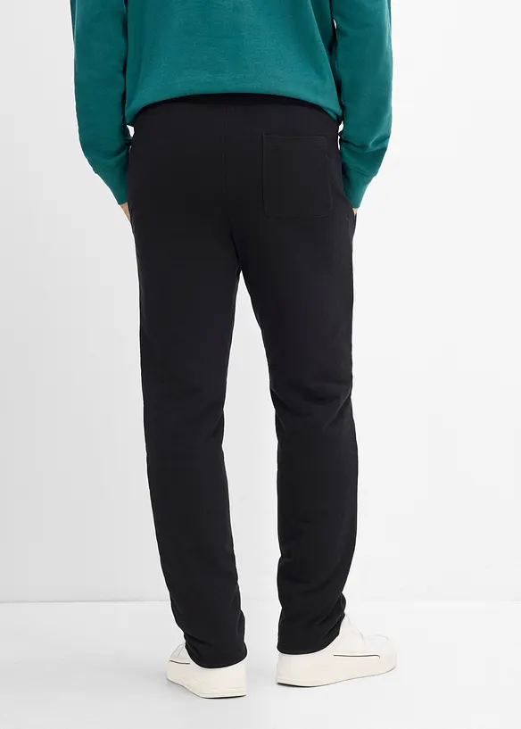 Thermo-Jogginghose mit Kuschelfleece in schwarz von hinten - bonprix