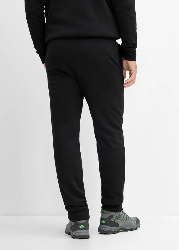 Thermo-Jogginghose mit flauschigem Teddyfleece in schwarz von hinten - bonprix