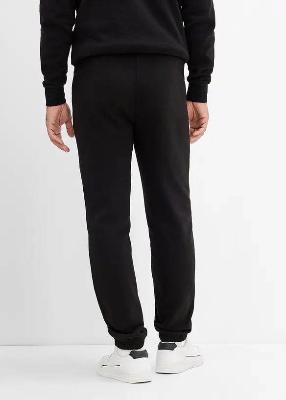 Fleece-Jogginghose in Regular Fit in schwarz von hinten - bonprix