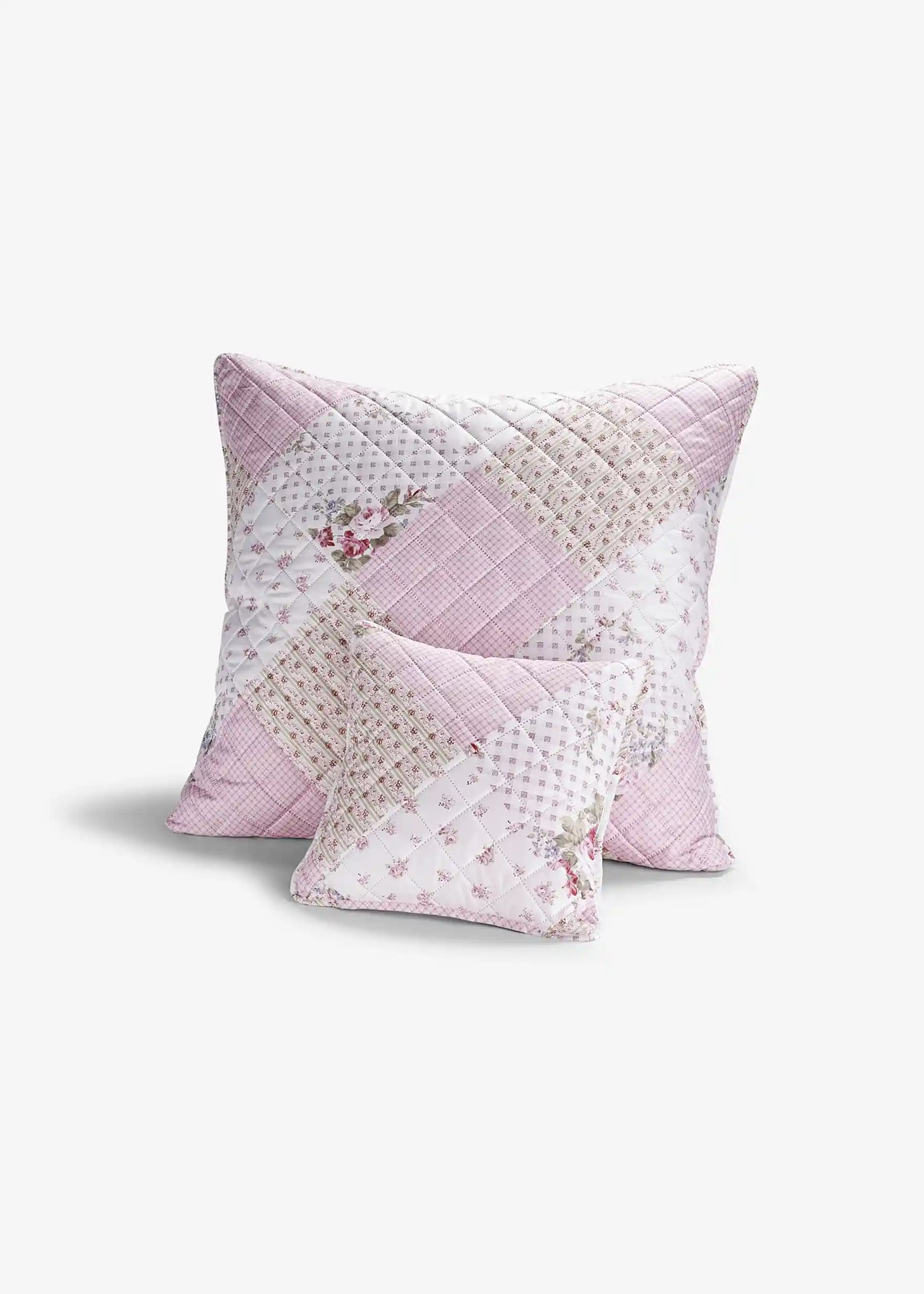 Kissenbezug im Patchwork Design. Die Rückseite ist einfarbig in rosa gehalten